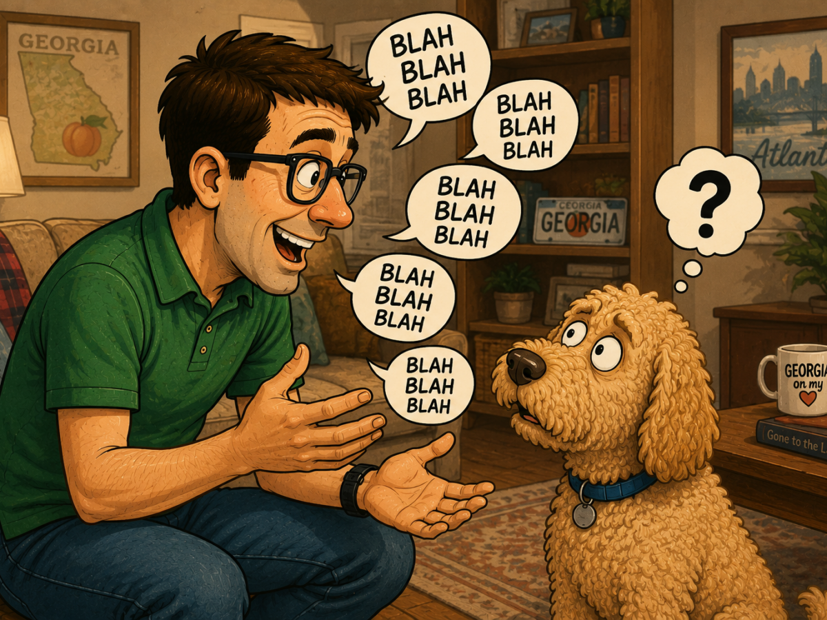 Man talks animatedly to a puzzled dog in a cozy living room with Georgia decor.