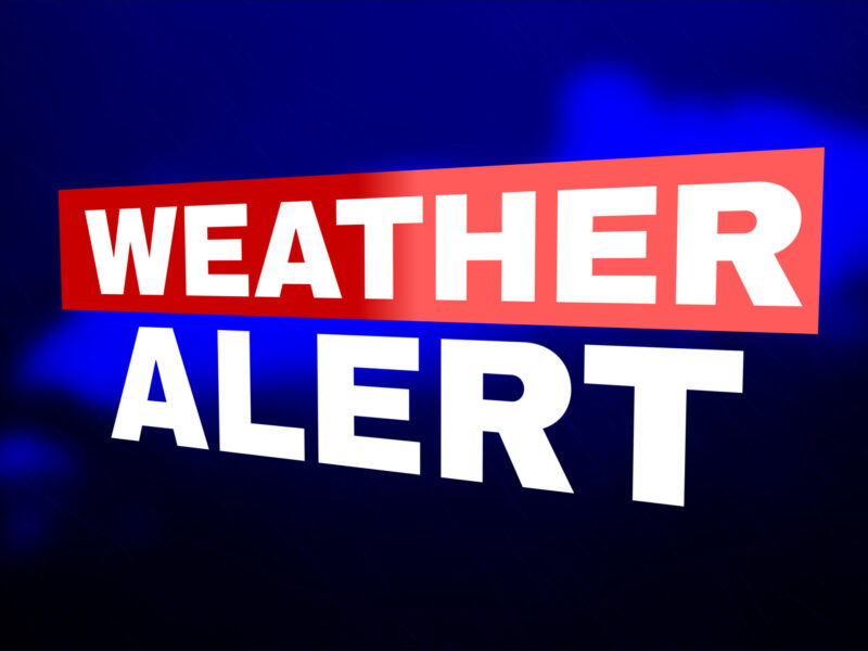 Weather alert text over a dark blue and black background