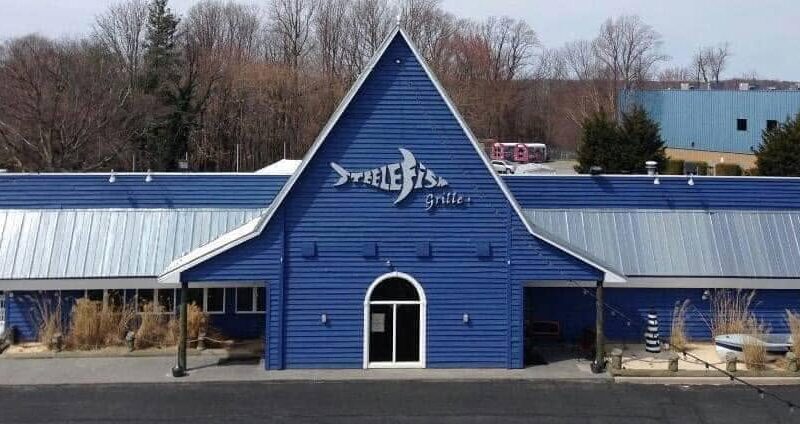 Blue SteelFish grille building with a steep front gable and silver metal roof